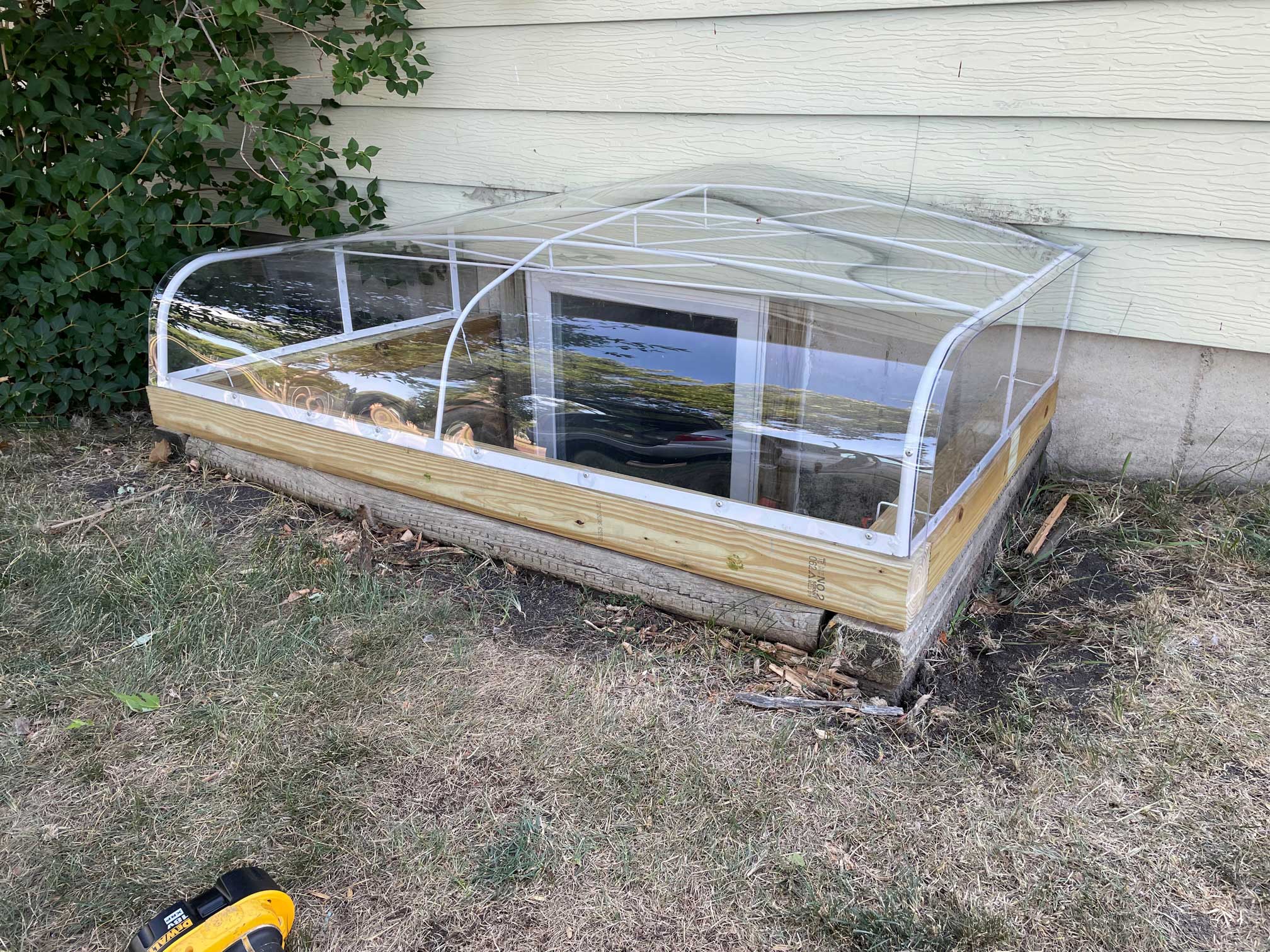 Transparent window well cover installation
