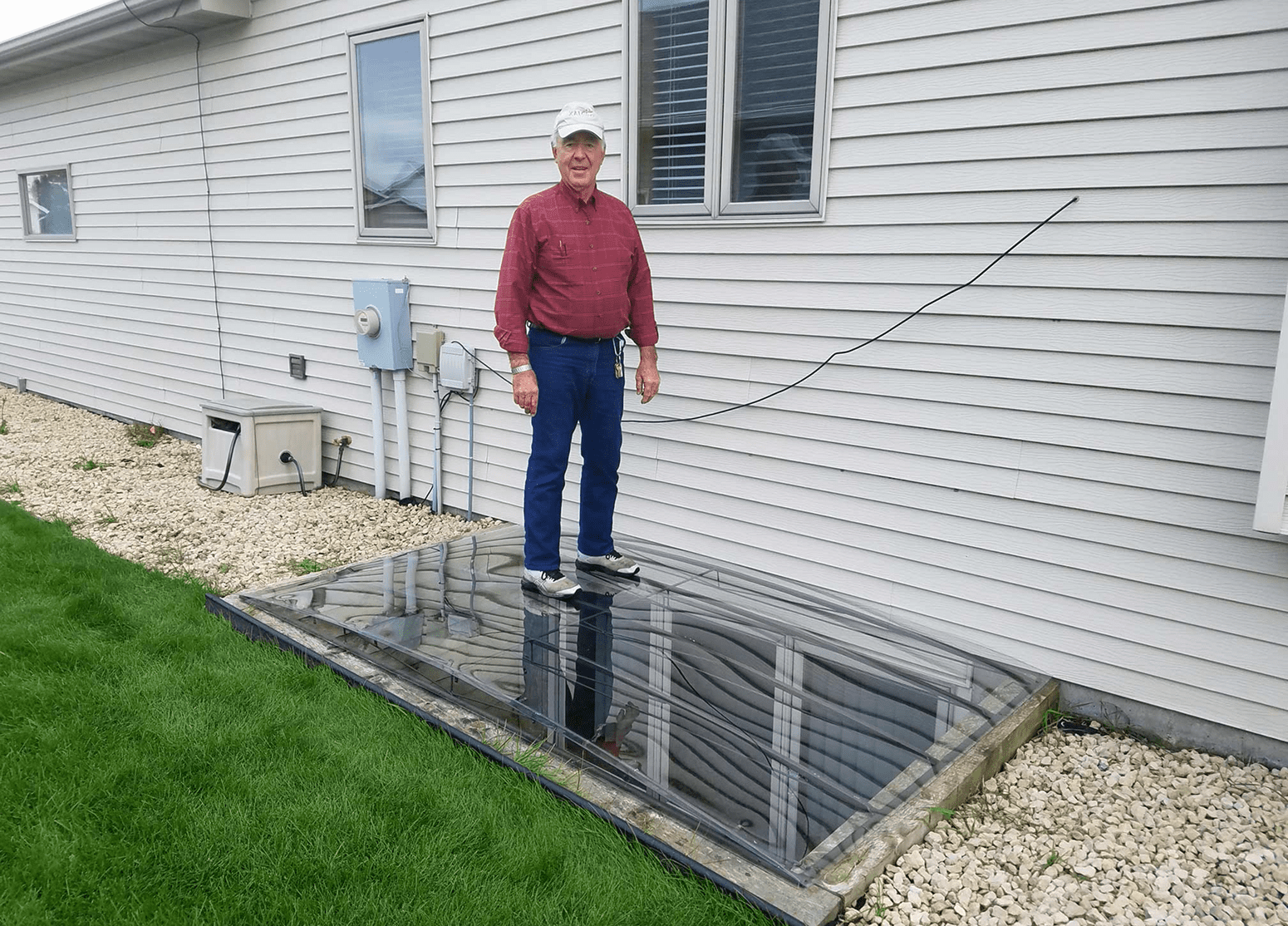 Individual atop outdoor window cover