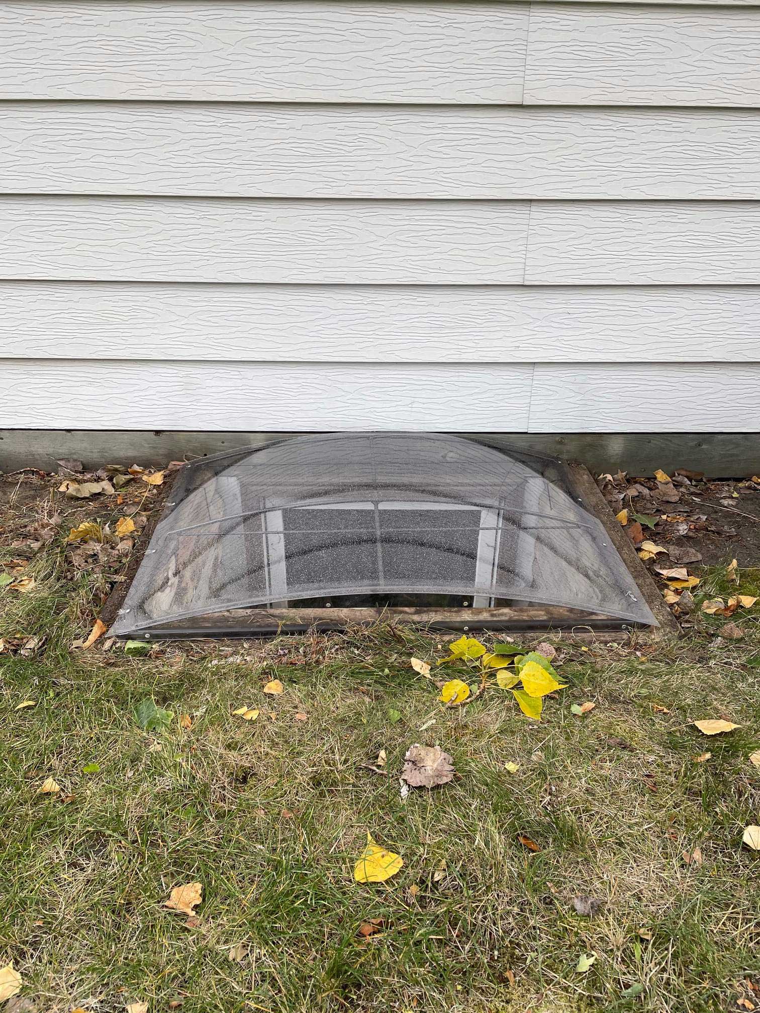 Clear domed basement window well cover
