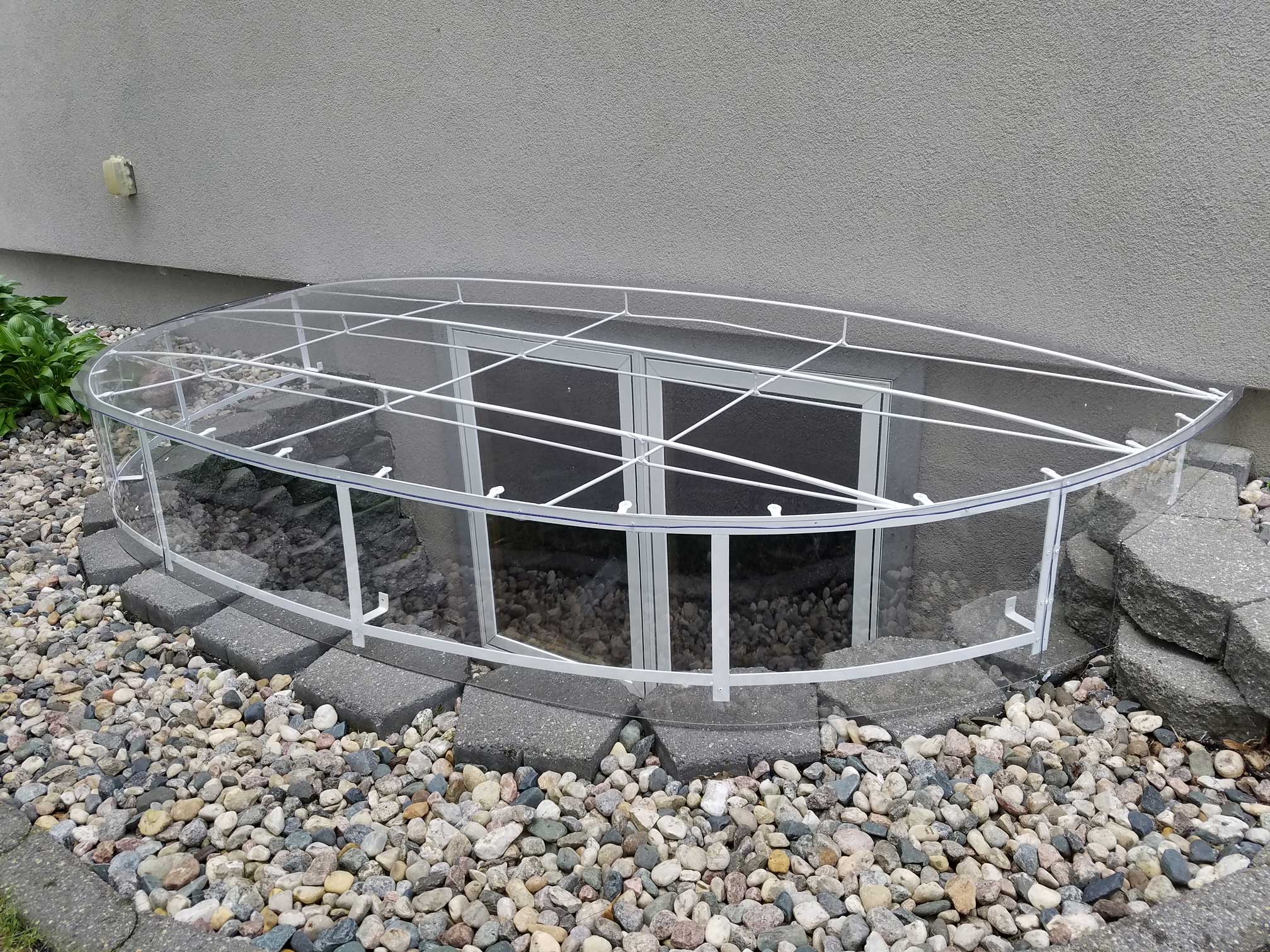 Clear oval basement window well cover