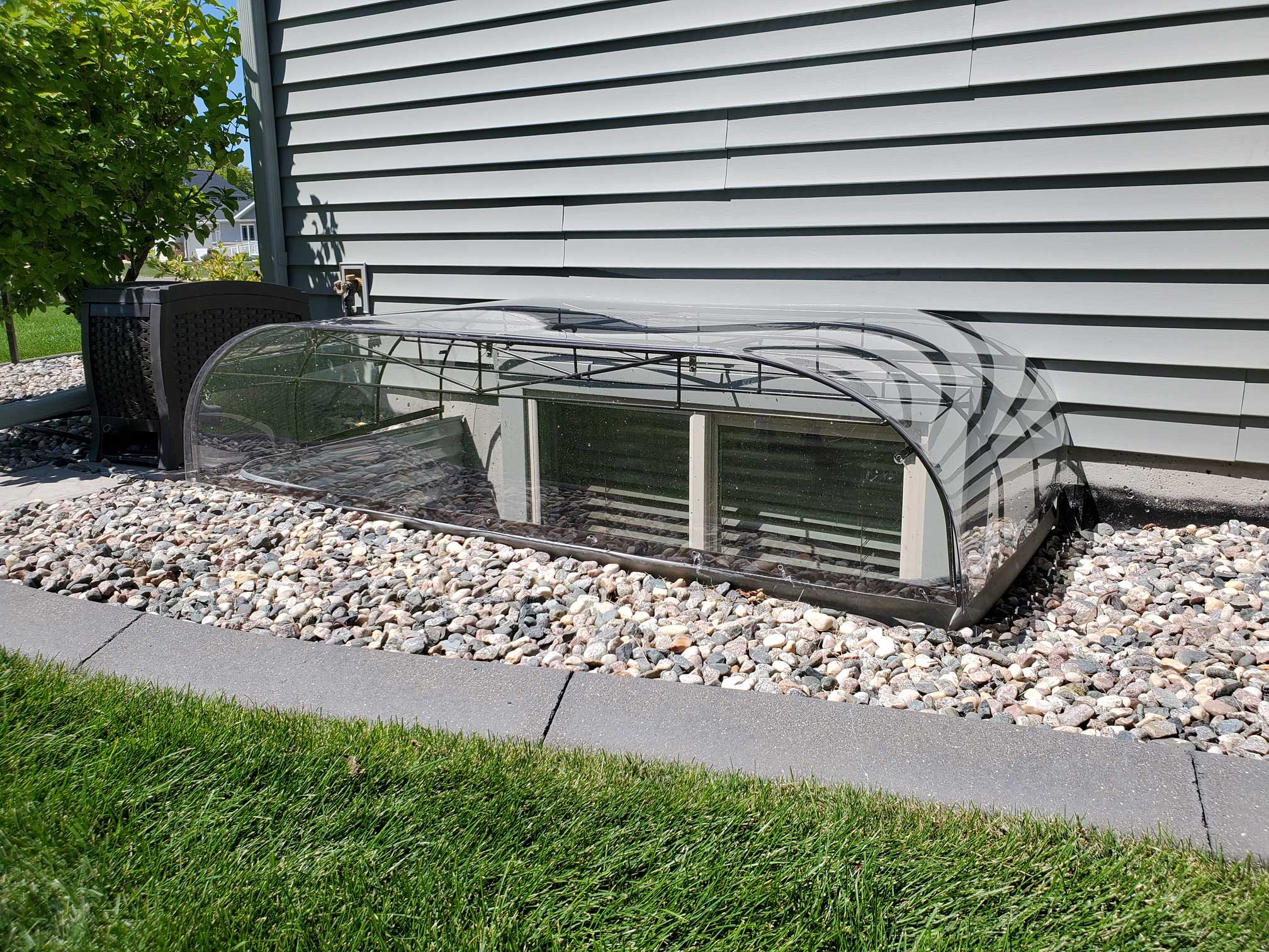 Clear polycarbonate basement window well cover