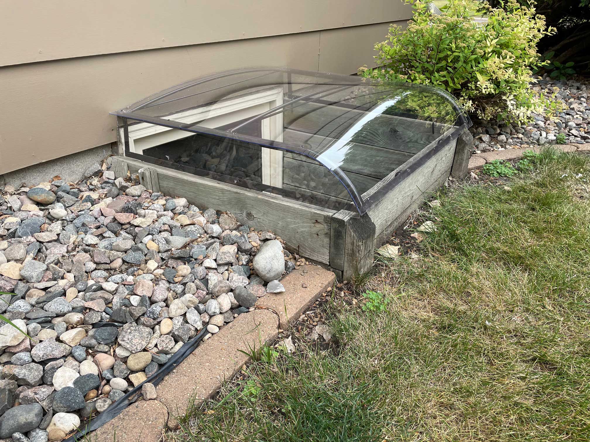 clear plastic basement window well cover