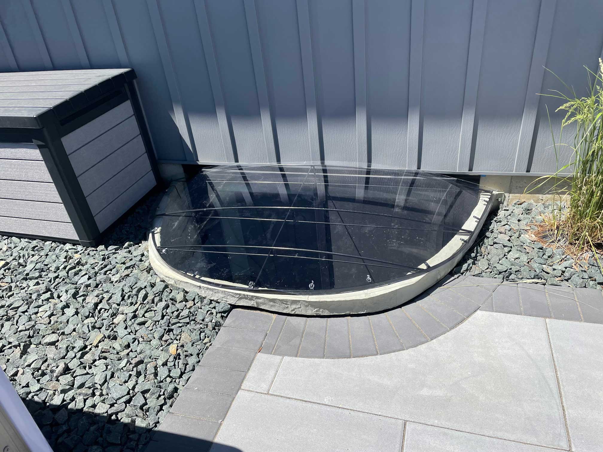 Clear plastic basement window well cover